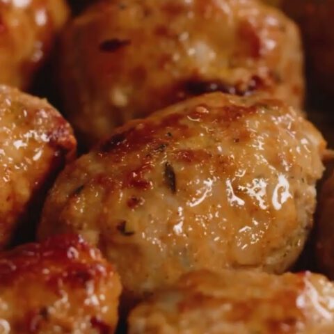 Meatballs with fine green peas in creamy sauce